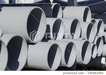 Gray PVC pipes stacked outdoors Gray PVC pipes stacked outdoors 140862885