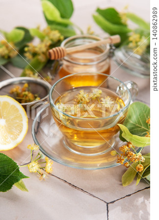 Linden flower herbal tea with honey and lemon Linden flower herbal tea with honey and lemon 140862989