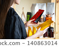 Customer Comparing Coffee Products Before Purchase, Evaluating Product Information And Ingredients To Make Informed Consumer Choice In Grocery Store, Product Comparison Concept 140863014