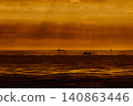 incredible reflection on the water at sunset, Yachtsmen are sitting amicably on board the boat, sailing boat is in sailing regatta in the Gulf of Finland at sunset, hot race, teamwork 140863446