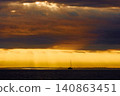 incredible reflection on the water at sunset, Yachtsmen are sitting amicably on board the boat, sailing boat is in sailing regatta in the Gulf of Finland at sunset, hot race, teamwork 140863451