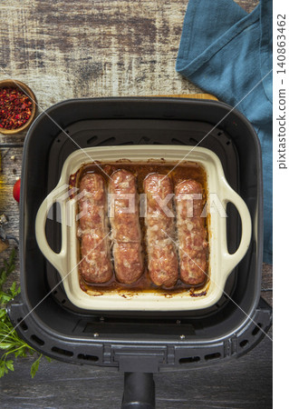 Grilled sausages baked with vegetables on a stone countertop. Healthy eating, quick cooking. Comfort food meal. Top view flat lay background. Copy space. Grilled sausages baked with vegetables on a stone countertop. Healthy eating, quick cooking. Comfort food meal. Top view flat lay background. Copy space. 140863462