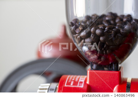 Coffee bean grinder and coffee beans Coffee bean grinder and coffee beans 140863496