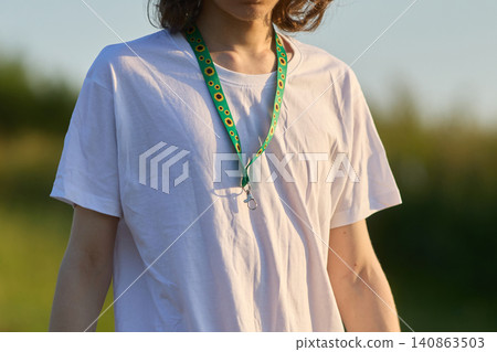Person wearing hidden disability sunflower lanyard Person wearing hidden disability sunflower lanyard 140863503