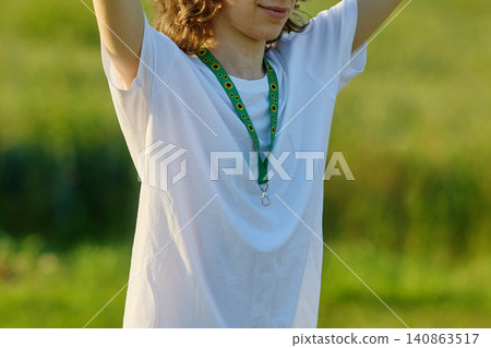 Person wearing sunflower lanyard for hidden disabilities awareness 140863517