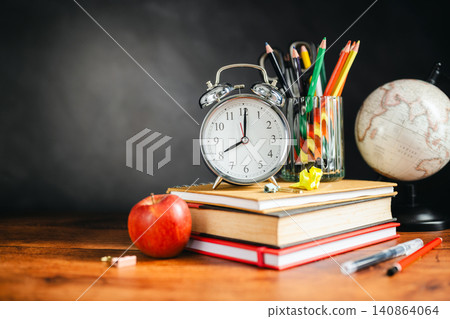 Time management for students with books and globe, back to school concept, copy space Time management for students with books and globe, back to school concept, copy space 140864064