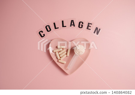 Collagen capsules and powder in heart shaped dish with collagen lettering Collagen capsules and powder in heart shaped dish with collagen lettering 140864082