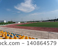 Empty Football Stadium with Running Track and Soccer Field 140864579