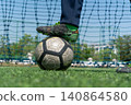 Football Player Foot on Soccer Ball Before Training 140864580