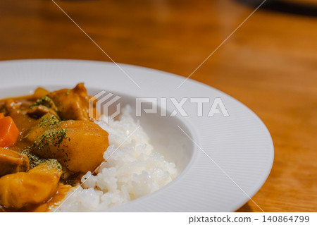 A close-up of curry rice served on a white plate. (Copy space available) A close-up of curry rice served on a white plate. (Copy space available) 140864799