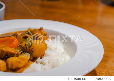 A set of warm curry rice served with soup. A set of warm curry rice served with soup. 140864800