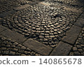 Abstract cobblestone pavement pattern with circular stone design illuminated by warm sunlight, highlighting texture, geometry, craftsmanship, historic character, and urban surface detail 140865678