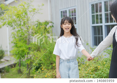 A little girl holding her mother's hand A little girl holding her mother's hand 140865959