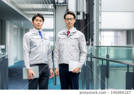 A man wearing work clothes A man wearing work clothes 140866187