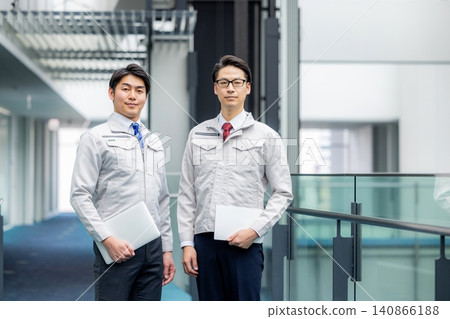 A man wearing work clothes A man wearing work clothes 140866188