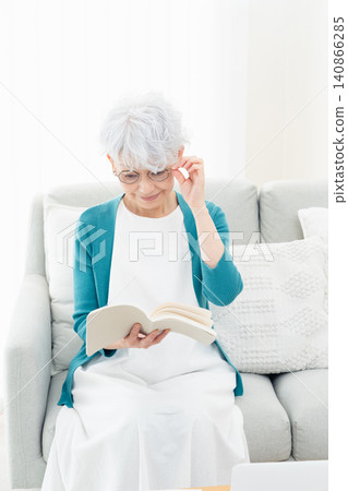 Senior woman reading a book Senior woman reading a book 140866285