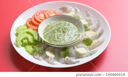 shrimp in fish sauce with Thai spicy seafood dipping sauce on white plate shrimp in fish sauce with Thai spicy seafood dipping sauce on white plate 140866419