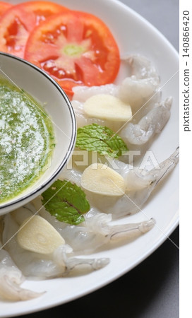 shrimp in fish sauce with Thai spicy seafood dipping sauce on white plate shrimp in fish sauce with Thai spicy seafood dipping sauce on white plate 140866420