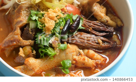 rice vermicelli with northern thai curry sauce on blue background rice vermicelli with northern thai curry sauce on blue background 140866453