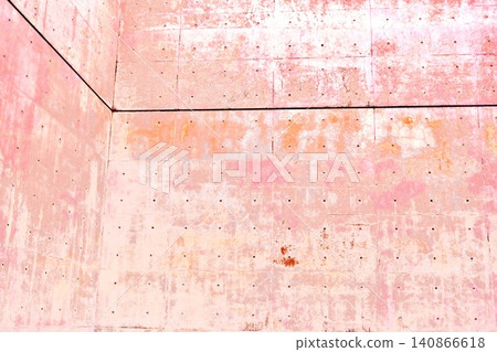 A minimalist architectural space with exposed concrete walls adorned in soft pink. A minimalist architectural space with exposed concrete walls adorned in soft pink. 140866618