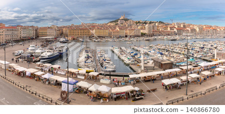 Marseille Old Port with yachts and historic waterfront under blue sky, France Marseille Old Port with yachts and historic waterfront under blue sky, France 140866780