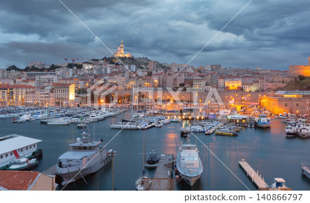 Marseille Old Port marina at blue hour with Notre-Dame de la Garde, France Marseille Old Port marina at blue hour with Notre-Dame de la Garde, France 140866797