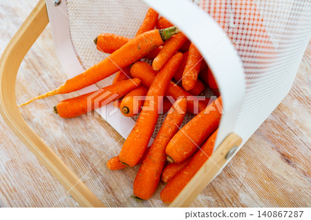 Many of fresh carrots in basket Many of fresh carrots in basket 140867287