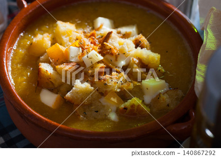 Cream soup with croutons and cheese Cream soup with croutons and cheese 140867292