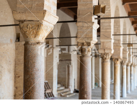 Long corridors under vaulted ceiling in ancient mosque of Kairouan in Tunisia. Long corridors under vaulted ceiling in ancient mosque of Kairouan in Tunisia. 140867493