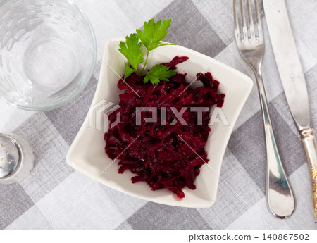 Popular russian salad, made from boiled grated beetroot, decorated with herbs Popular russian salad, made from boiled grated beetroot, decorated with herbs 140867502