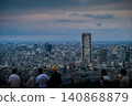 People gazing at the night view and the lights of skyscrapers 140868879