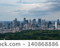 The skyscrapers of Shinjuku's sub-city center spread out beyond the lush green grove. 140868886