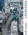 A highway winding through the urban skyline (daytime) 140868888