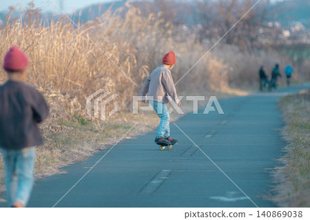 A child skateboarding A child skateboarding 140869038