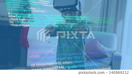 Reaching child wearing green shirt and VR headset in living room, projecting code overlay Reaching child wearing green shirt and VR headset in living room, projecting code overlay 140869212