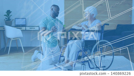 Explaining caregiver wearing polo kneeling beside senior in wheelchair at home, holding tablet HUD Explaining caregiver wearing polo kneeling beside senior in wheelchair at home, holding tablet HUD 140869226