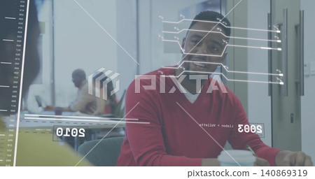 Smiling man in red sweater sitting at meeting table with glass AR graphics, holding coffee cup Smiling man in red sweater sitting at meeting table with glass AR graphics, holding coffee cup 140869319