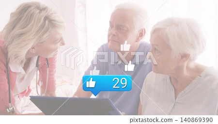 Leaning nurse in pink cardigan consulting couple on bed, showing tablet, stethoscope, thumbs-up 29 Leaning nurse in pink cardigan consulting couple on bed, showing tablet, stethoscope, thumbs-up 29 140869390
