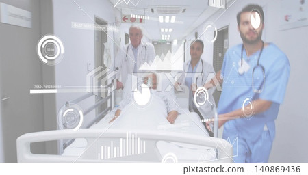 Wheeling patient on stretcher down hospital corridor, team in white coats and scrubs, HUD overlay Wheeling patient on stretcher down hospital corridor, team in white coats and scrubs, HUD overlay 140869436