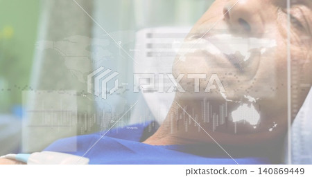 Lying male in blue gown on hospital bed, showing sensor, pillow and data overlay, copy space Lying male in blue gown on hospital bed, showing sensor, pillow and data overlay, copy space 140869449
