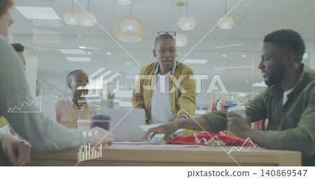 Leaning over wooden table in office, leader wearing tan bomber jacket presenting data with laptop Leaning over wooden table in office, leader wearing tan bomber jacket presenting data with laptop 140869547