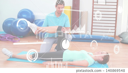 Kneeling practitioner in polo guiding client in top with knee support on blue mat, HUD overlays Kneeling practitioner in polo guiding client in top with knee support on blue mat, HUD overlays 140869548