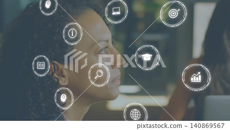 Listening mature woman focusing on meeting in office, wearing dark top with laptop and UI icons Listening mature woman focusing on meeting in office, wearing dark top with laptop and UI icons 140869567