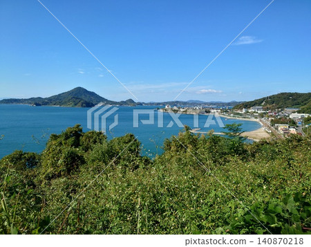A beautiful natural landscape overlooking islands under a clear blue sky and calm blue sea. A beautiful natural landscape overlooking islands under a clear blue sky and calm blue sea. 140870218