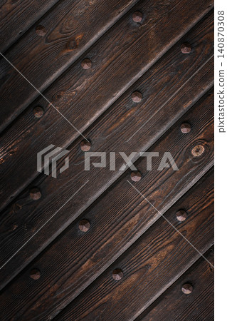 Rustic diagonal dark brown yakisugi wooden boards texture background with vintage metallic forged rivets. Aged timber wall mockup pattern. Rustic diagonal dark brown yakisugi wooden boards texture background with vintage metallic forged rivets. Aged timber wall mockup pattern. 140870308