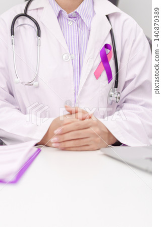 doctor using laptop and report notes on notebook. purple and pink ribbon concept of September Thyroid Cancer Awareness month, Healthcare and February world cancer day doctor using laptop and report notes on notebook. purple and pink ribbon concept of September Thyroid Cancer Awareness month, Healthcare and February world cancer day 140870389
