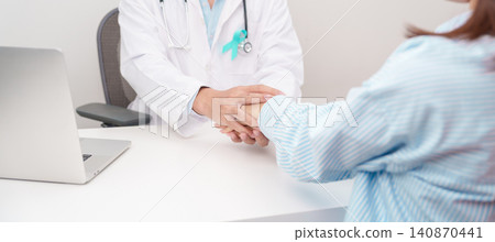 doctor holding patient hand to comfort and support with empathy. Teal ribbon concept of September Ovarian Cancer Awareness month, PCOS, January Cervical Cancer, April Sexual Assault, June PSTD doctor holding patient hand to comfort and support with empathy. Teal ribbon concept of September Ovarian Cancer Awareness month, PCOS, January Cervical Cancer, April Sexual Assault, June PSTD 140870441