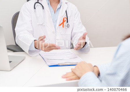 Doctor and patient having consultation with orange ribbon for February World Cancer Day, September Leukemia, March Kidney, August Appendix cancer, Multiple Sclerosis, November CRPS and COPD Doctor and patient having consultation with orange ribbon for February World Cancer Day, September Leukemia, March Kidney, August Appendix cancer, Multiple Sclerosis, November CRPS and COPD 140870466