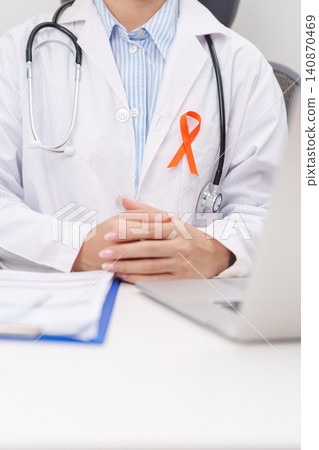 Professional doctor using laptop and writing notes for February World Cancer Day, September Leukemia, March Kidney, August Appendix, Multiple Sclerosis, November CRPS and COPD disease concept Professional doctor using laptop and writing notes for February World Cancer Day, September Leukemia, March Kidney, August Appendix, Multiple Sclerosis, November CRPS and COPD disease concept 140870469