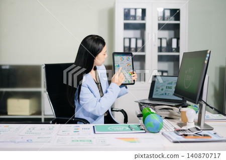Asian Businesswoman Presenting Net Zero and ESG Sustainability Strategy in Corporate Office Asian Businesswoman Presenting Net Zero and ESG Sustainability Strategy in Corporate Office 140870717